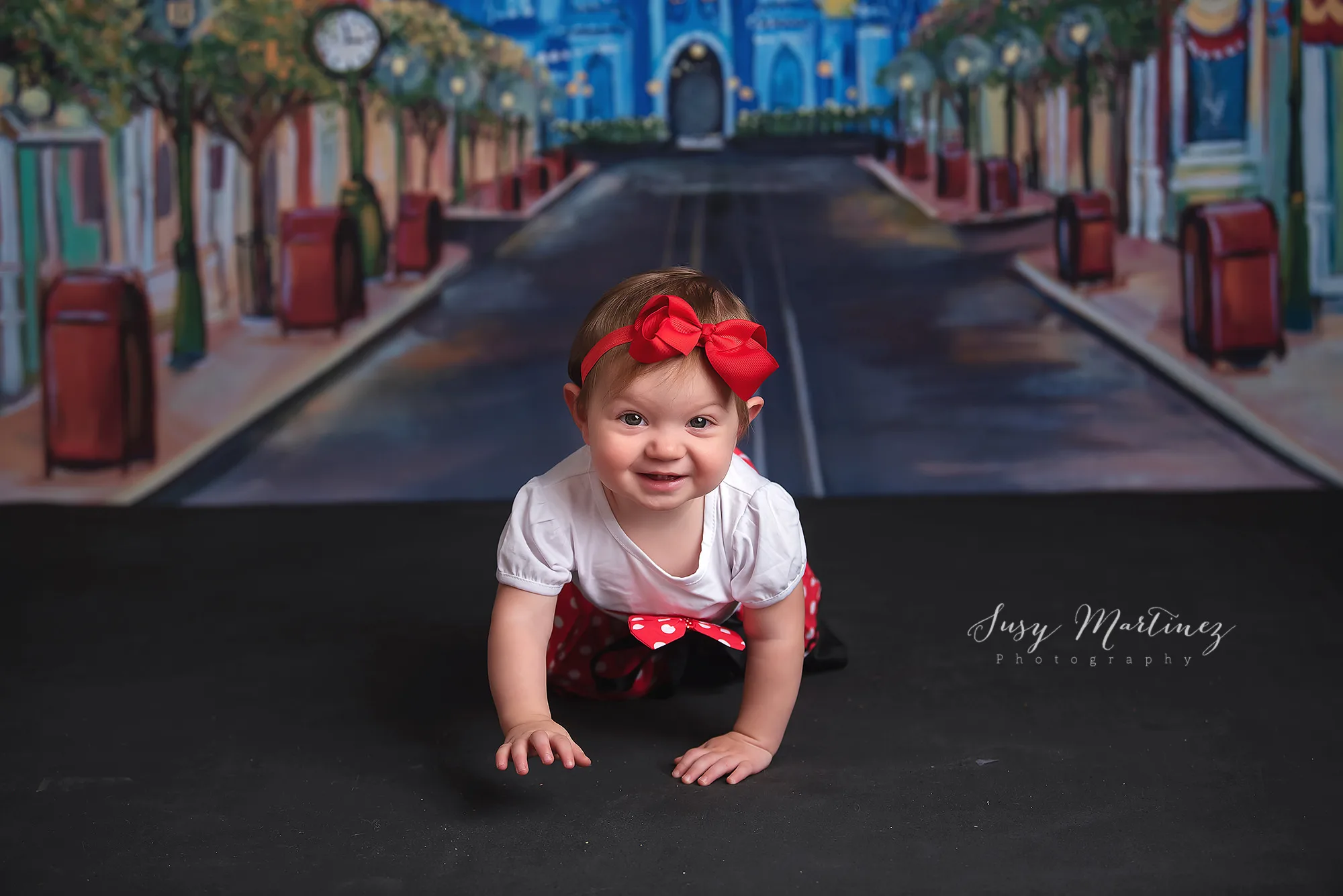 baby crawls in studio during Main Street USA milestone portraits