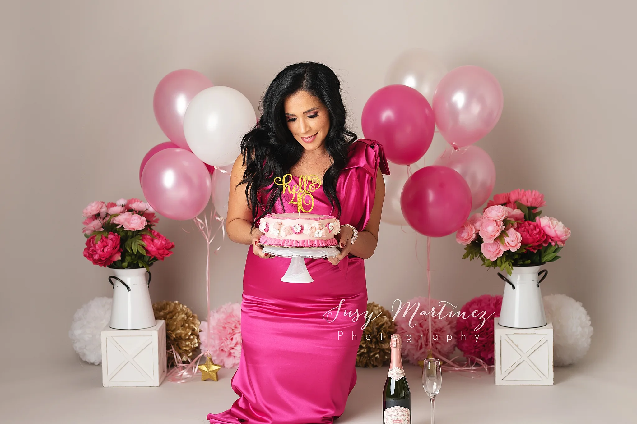 40th birthday cake smash for woman in pink dress