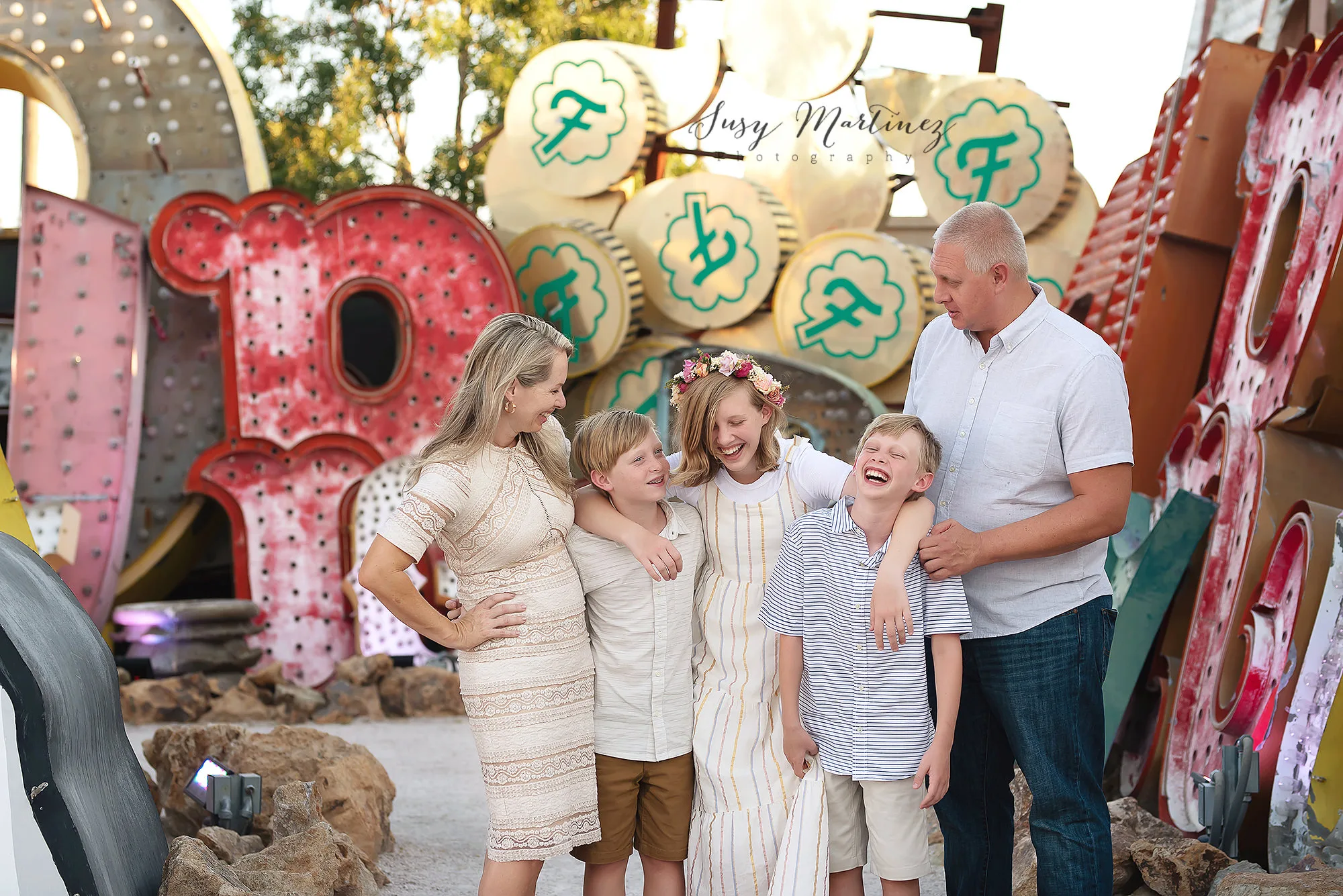 family of five poses together in Neon Boneyard with Susy Martinez Photography