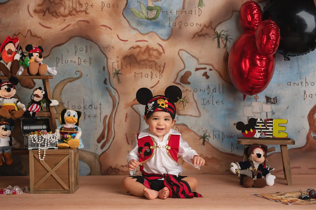 baby in pirate outfit plays during cake smash with Las Vegas photographer 