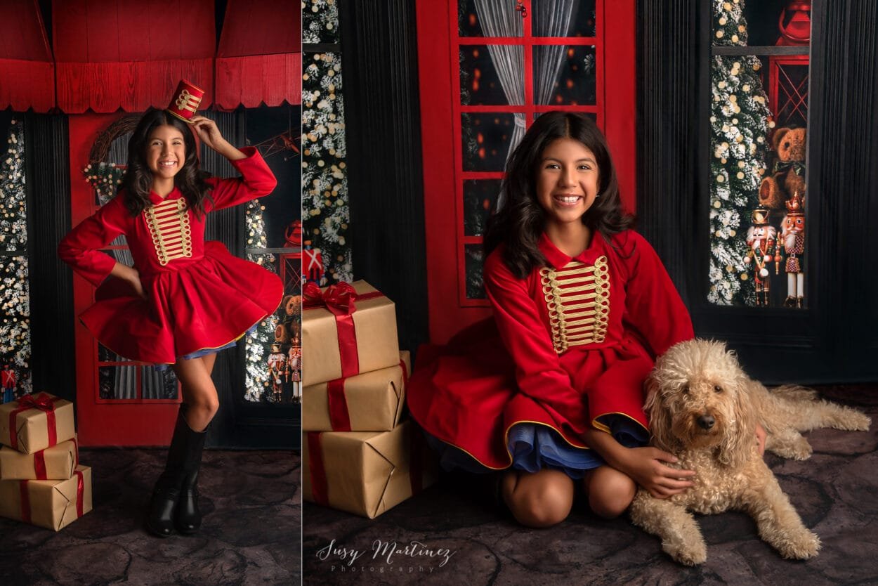 girl in a nutcracker dress holding a golden doodle dog